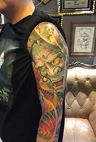 Patrón de tatuaxe boomer masculino e calamar pintado