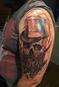 tatuazh skull, krahu i djalit, fotografia e tatuazhit të kafkës
