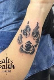 Boy's arm on black gray point thorn small animal wolf head tattoo picture