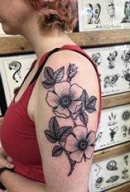 Mkono wa shule juu ya nyeusi hatua mwiba rahisi mmea ua tattoo picha