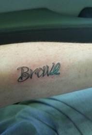 Boy's arm on painted gradient and black pricked stitching English word tattoo picture