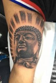 Tattoo obrázek tetované postavy sochy Buddhy černé šedé na mužské paži