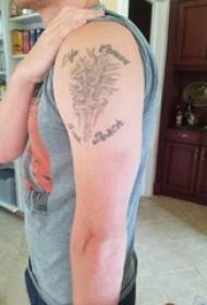 手臂交叉紋身男手臂上的十字架和英語紋身圖片