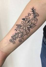 Literary flower tattoo, delicate flower tattoo picture on girl's arm