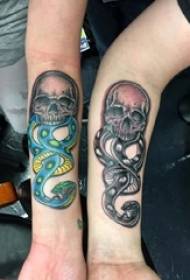 Skull tattoo, male arm, squat tattoo snake picture