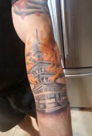 Building tetovējums zēna roku uz liesmas un ēkas tetovējums attēlu