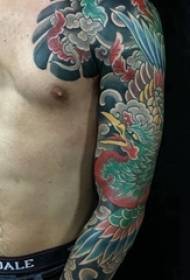 Japanese tattoo, male arm, coloured flower arm tattoo picture