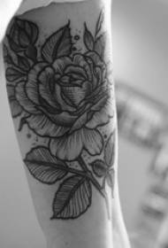 Ruka školarke na slici crne bodlje jednostavne crte biljke cvijet tetovaža