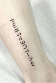 Girl's arm on black line minimalist letter tattoo picture