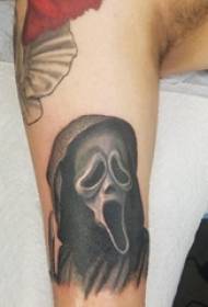 Brațul băiatului tatuajului fantomă pe poza tatuajului feței fantomă