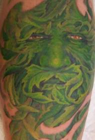 mudellu di tatuu di mostru di culore verde perna