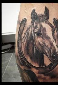 Leg realistic realistic style horse and horseshoe tattoo