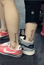 Creative English tattoo on couple calf