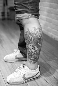 Black and white squid tattoo picture falling on the calf