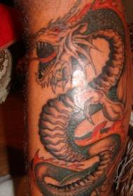 Ruggente motivo del tatuaggio del drago sulla gamba