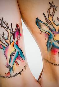 Gorgeous and colorful deer head portrait couple tattoo