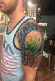Double big arm tattoo male big arm on chair and planet tattoo picture