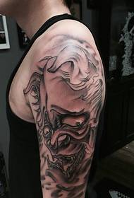Black and white small prajna tattoo on the big arm
