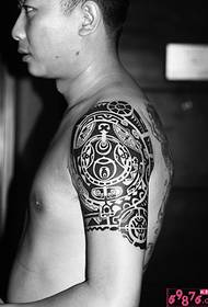 Big arm black and white totem tattoo