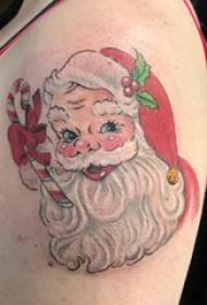 聖誕紋身男孩與彩色的聖誕老人紋身圖片上的大手臂