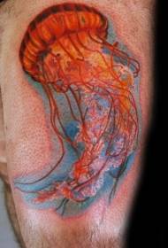 Colorido tatuaje de medusa en el muslo