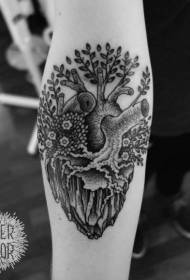 Nữ cánh tay trái tim màu đen với hình xăm cây