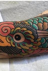 Tattoo bird, boy's arm, colored bird tattoo picture