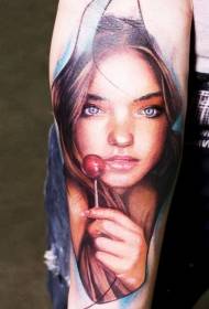 Arm color realistic girl portrait with lollipop tattoo