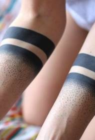 Black spotted tattoo pattern with arm fun design