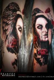 Arm colored women portrait and crow tattoo pattern