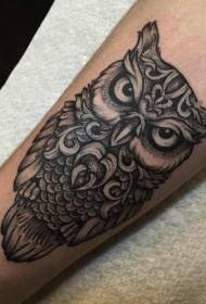 Male arm black owl tattoo pattern