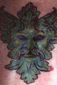 Patrón de tatuaje de cara de diablo verde