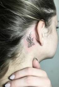A group of black small fresh tattoo designs behind the ear