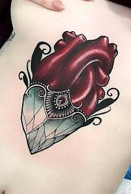 rinnassa sydämen alla geometrinen mosaiikki väri tatuointi malli