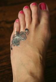 délicat motif de tatouage d'orchidée noire sur le cou-de-pied
