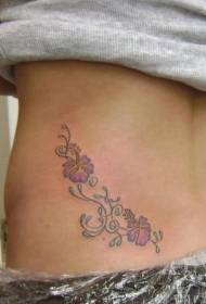 vrouwelijke taillezijde hibiscus tattoo foto