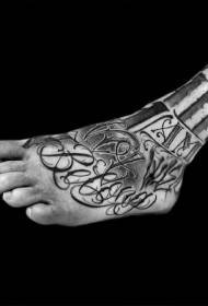 ຮູບແບບ tattoo ກະຮອກສີດໍາແລະສີຂາວທີ່ມີສີສັນສະຫລອງ