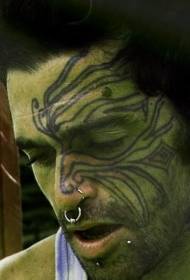 plemienny wzór tatuażu dla męskiej twarzy