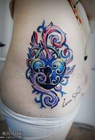 A female side waist color key tattoo pattern