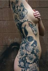 kvinnelig side midje og blomst tatoveringsbilde