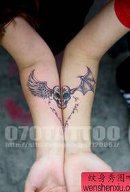 arm popular beautiful couple skull with wings tattoo pattern