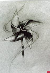 A tetováló show-kép egy szélmalom tetoválás kéziratmintáját javasolta