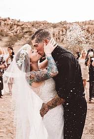 European couple shows a beautiful couple tattoo on the wedding day