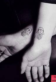 un picculu modellu di tatuaggi di coppia
