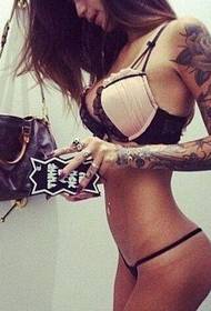 The combination of perfect body and tattoo reflects another beauty