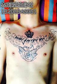 Chest atmospheric crown English tattoo