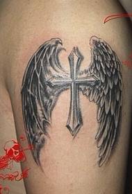 Winged cross tattoo