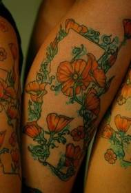 Modello tatuaggio braccio colorato papavero e vite