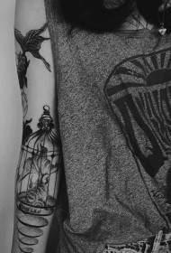 Arm goldfish birdcage black pricked creative tattoo pattern