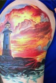 Arm flerfarget fyr og tatovering av solnedgang